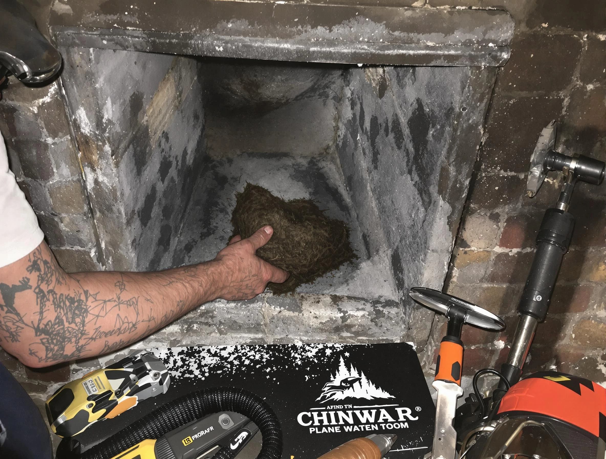Randolph Chimney Sweep safely removing debris and screening chimney in Randolph, NJ